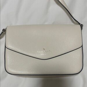 kate spade cream crossbody envelope bag with black trim
